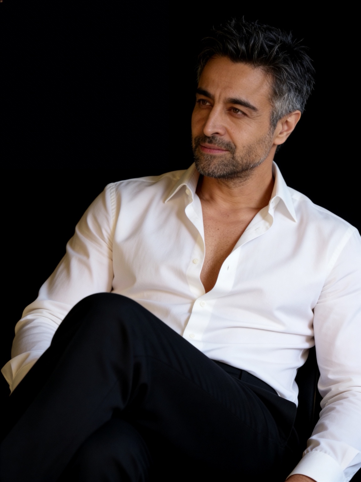 Nicholas Guilak — white shirt, dark studio portrait