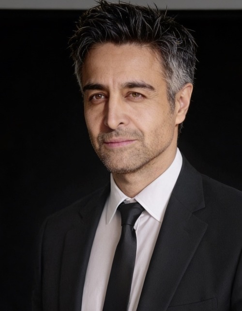 Nicholas Guilak — suit and tie dramatic portrait